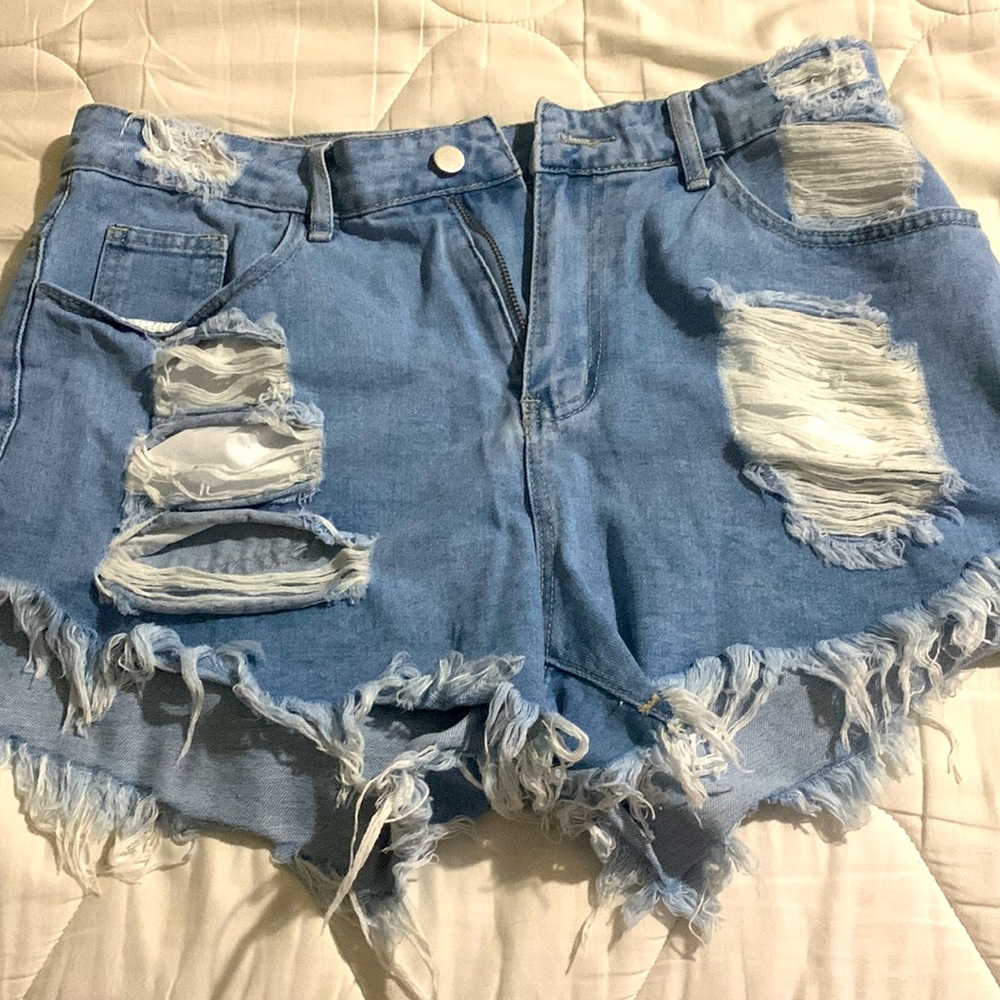 Heavily distressed denim shorts